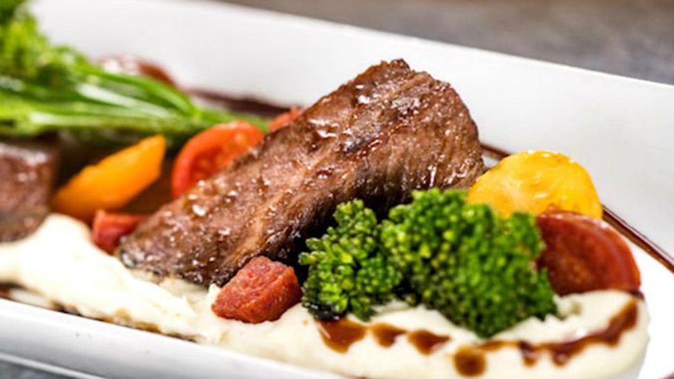 Red wine braised beef short rib with parsnip puree, broccolini, baby tomatoes and aged balsamic. (Courtesy of Disney)
