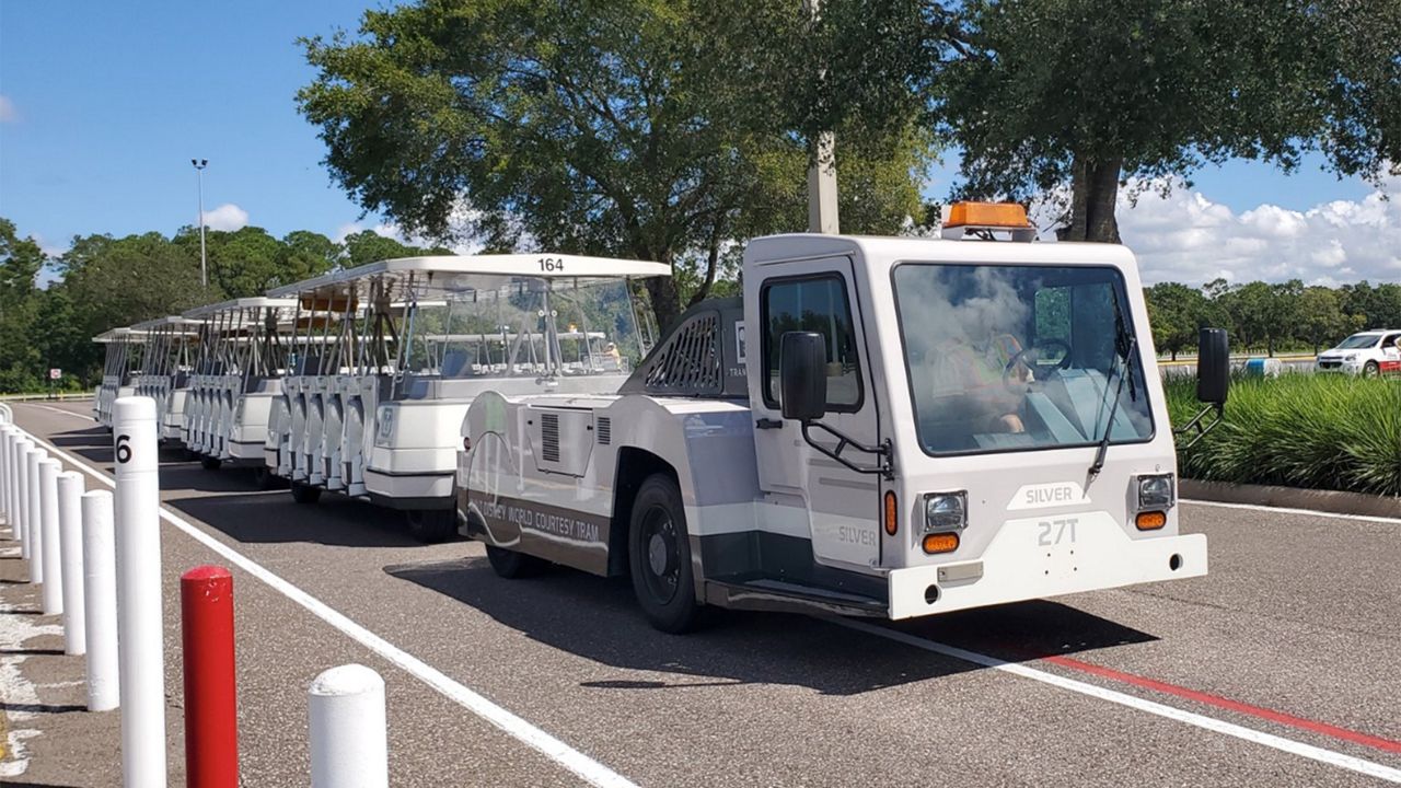 A parking lot tram at EPCOT arriving to pick up visitors in the parking lot. (Spectrum News/Ashley Carter)