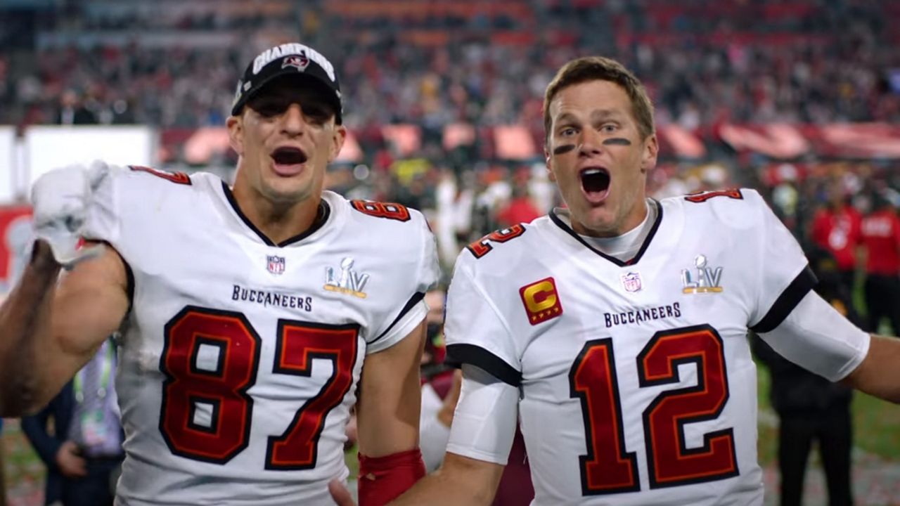 Tampa Bay Buccaneers players Rob Gronkowski and Tom Brady shout, "We're going to Disney World" following Super Bowl win against Kansas City Chiefs. (Courtesy of Disney)