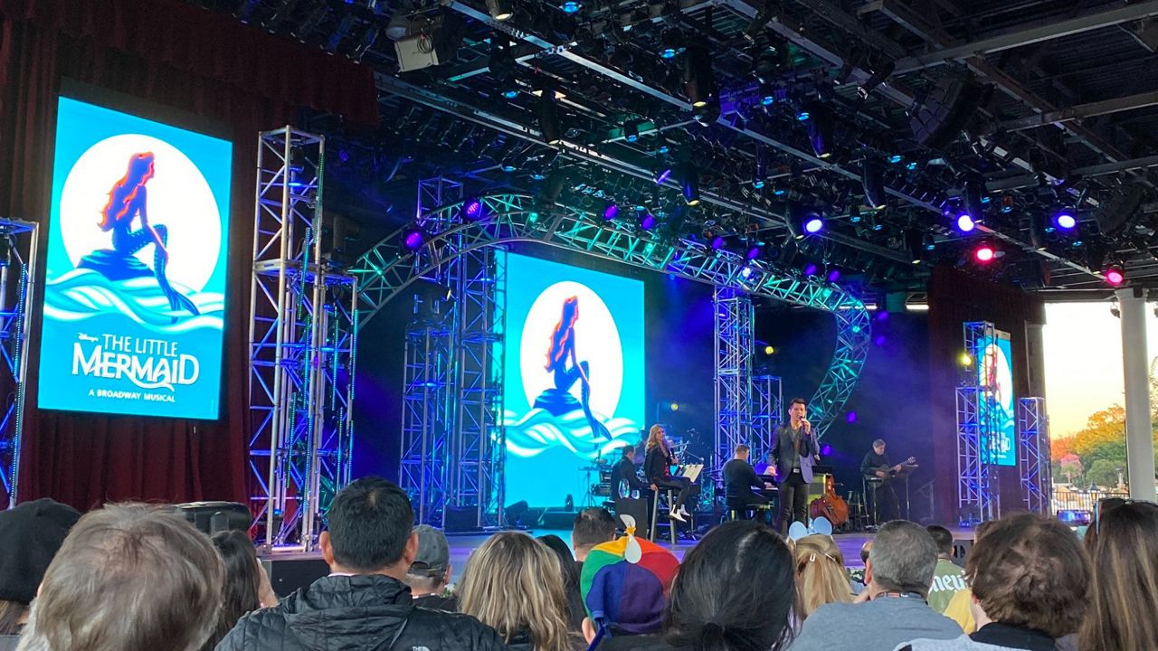 Telly Leung and Kerry Butler perform at Epcot as part of Disney on Broadway concert series during the Festival of the Arts. (Spectrum News/Ashley Carter)