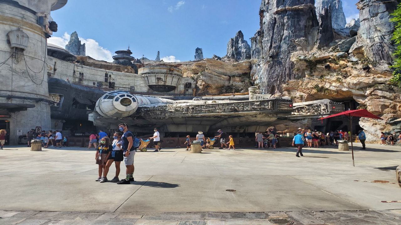 People stand in front of Millennium Falcon Smugglers Run at Star Wars: Galaxy's Edge at Disney's Hollywood Studios. (Ashley Carter/Spectrum News)