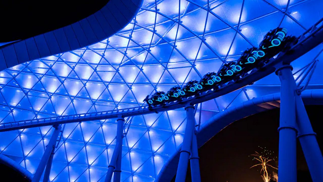 The Lightcycle ride vehicles illuminated during testing of TRON Lightcycle Run at Magic Kingdom. (Photo: Disney)