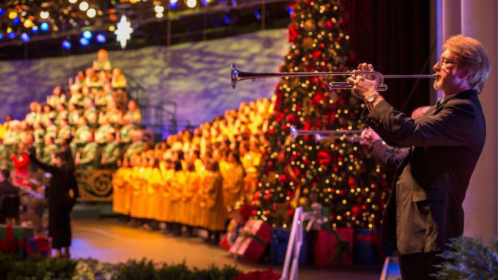 Candlelight Processional at Epcot include a celebrity narrator, mass choir and a live orchestra. (Disney)