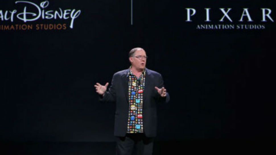 Pixar executive John Lasseter speaking to a crowd at Disney's D23 Expo in 2015. 