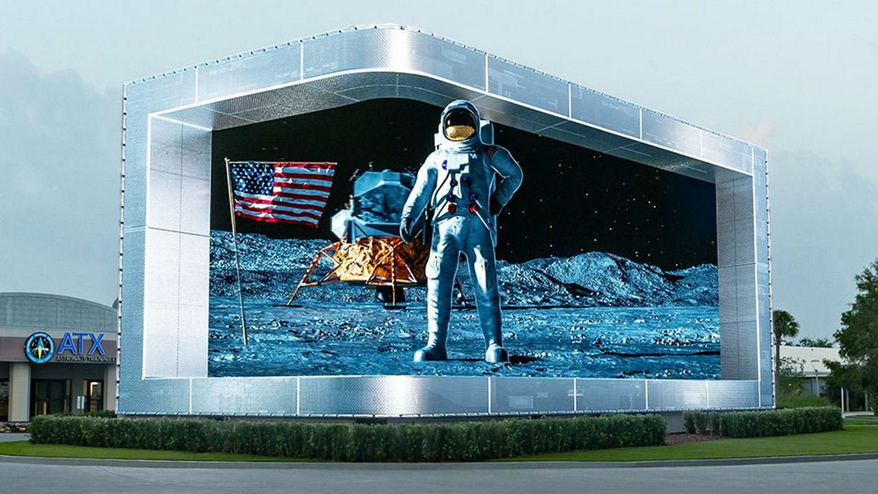 The new Kennedy Entry Experience is a large digital wall that highlights NASA's achievements in space exploration. (Photo: Kennedy Space Center)