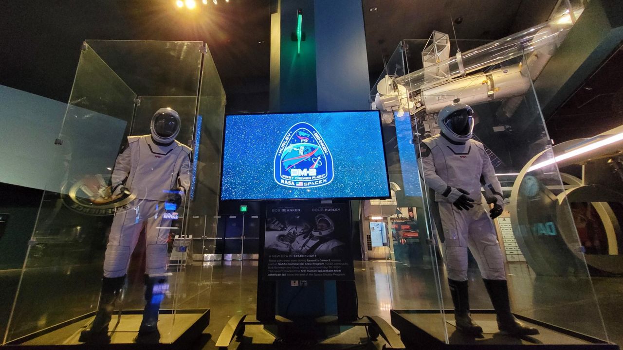 The high-tech spacesuits worn by NASA astronauts Robert Behnken and Douglas Hurley are on display at Kennedy Space Center Visitor Complex for a limited time. (Kennedy Space Center)