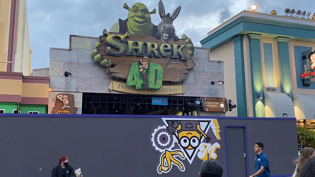 The now-closed Shrek 4-D attraction at Universal Studios Florida surrounded by construction walls featuring the Minions. (Spectrum News/Ashley Carter)