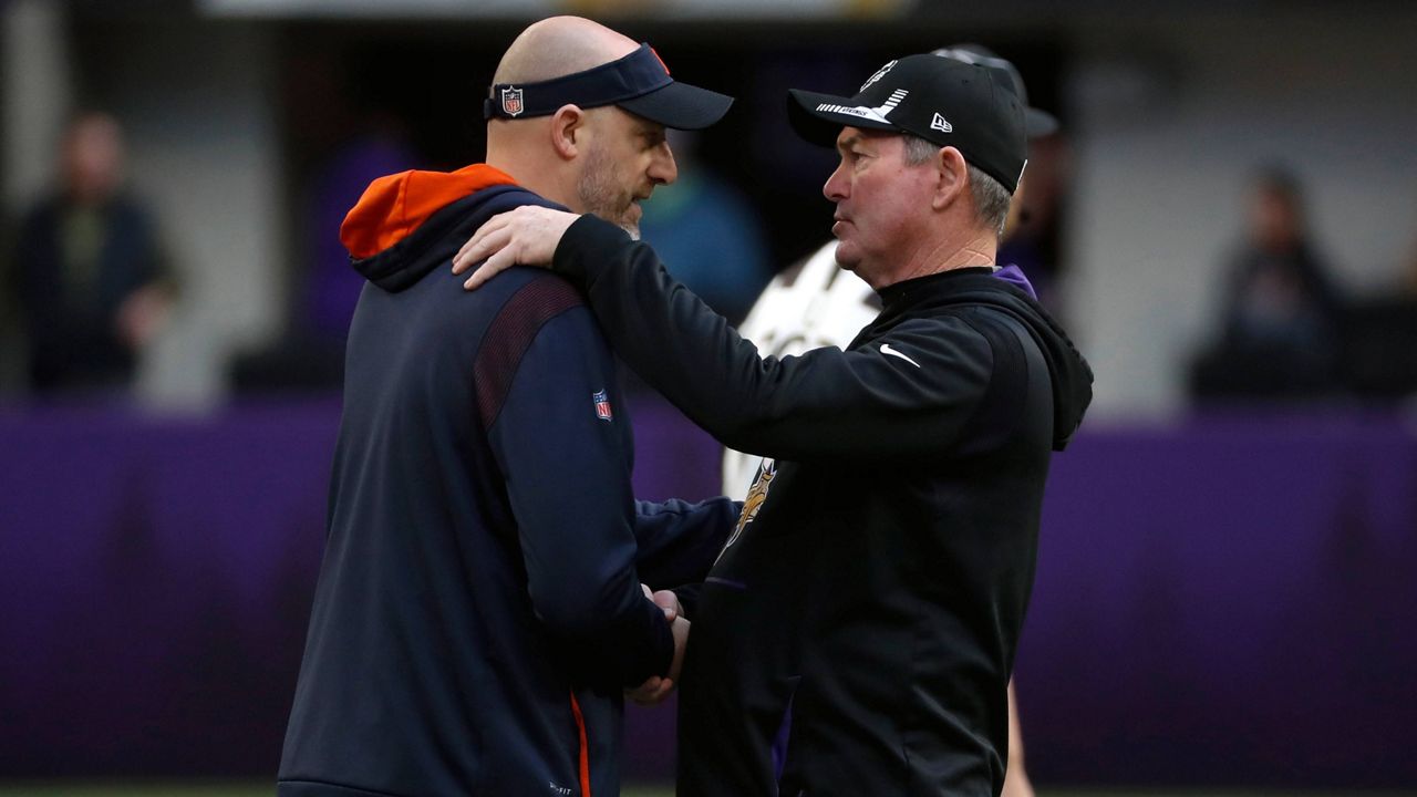 Bears coach Matt Nagy, left, talks with Vikings coach Mike Zimmer before their game Sunday in Minneapolis. (AP Photo/Bruce Kluckhohn)
