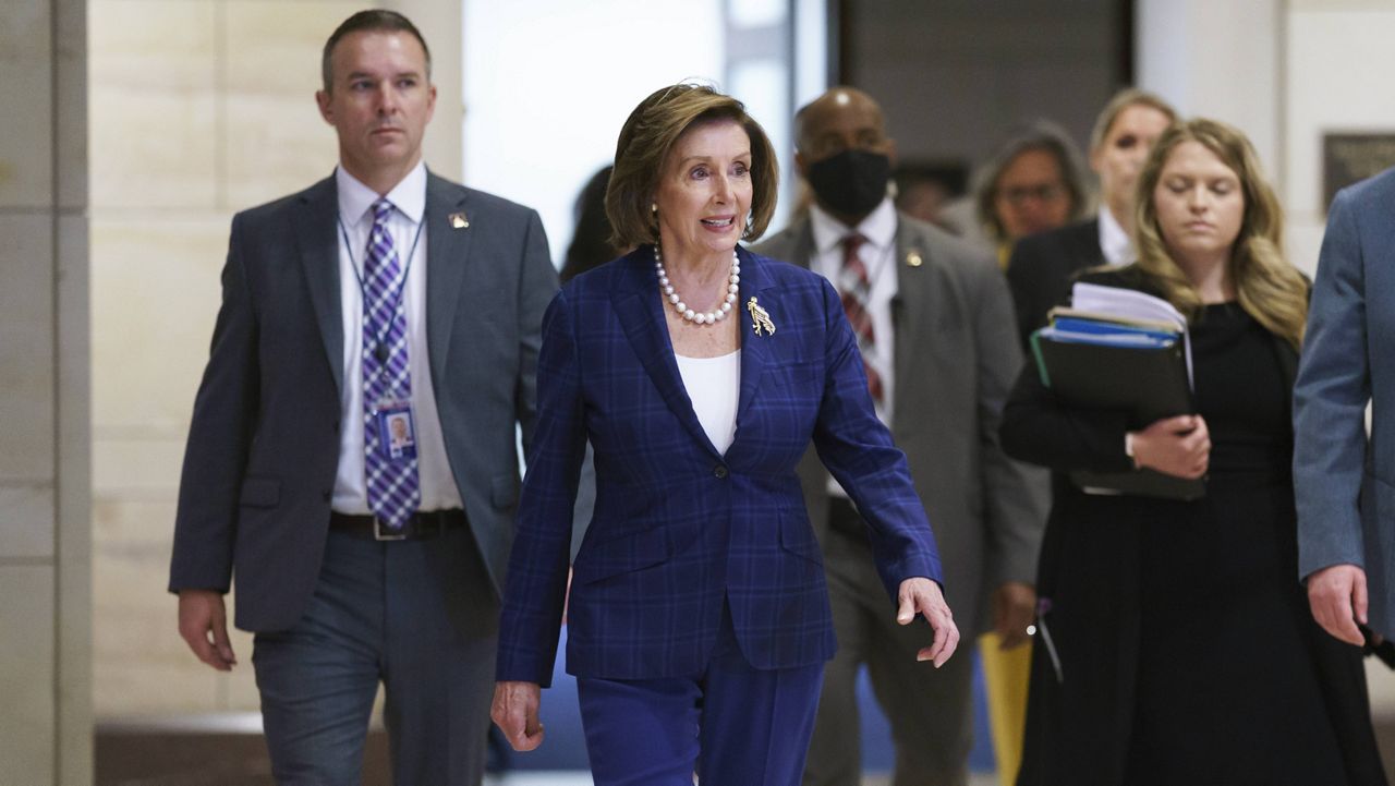 House Speaker Nancy Pelosi arrives at the Capitol on Tuesday for a meeting to discuss progress on an infrastructure bill. (AP Photo/J. Scott Applewhite)