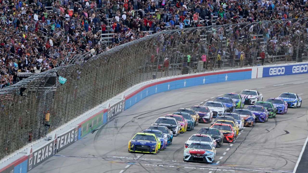 The green flags drops, starting the NASCAR All-Star auto race at Texas Motor Speedway in Fort Worth, Texas, Sunday, May 22, 2022. (AP Photo/Larry Papke)