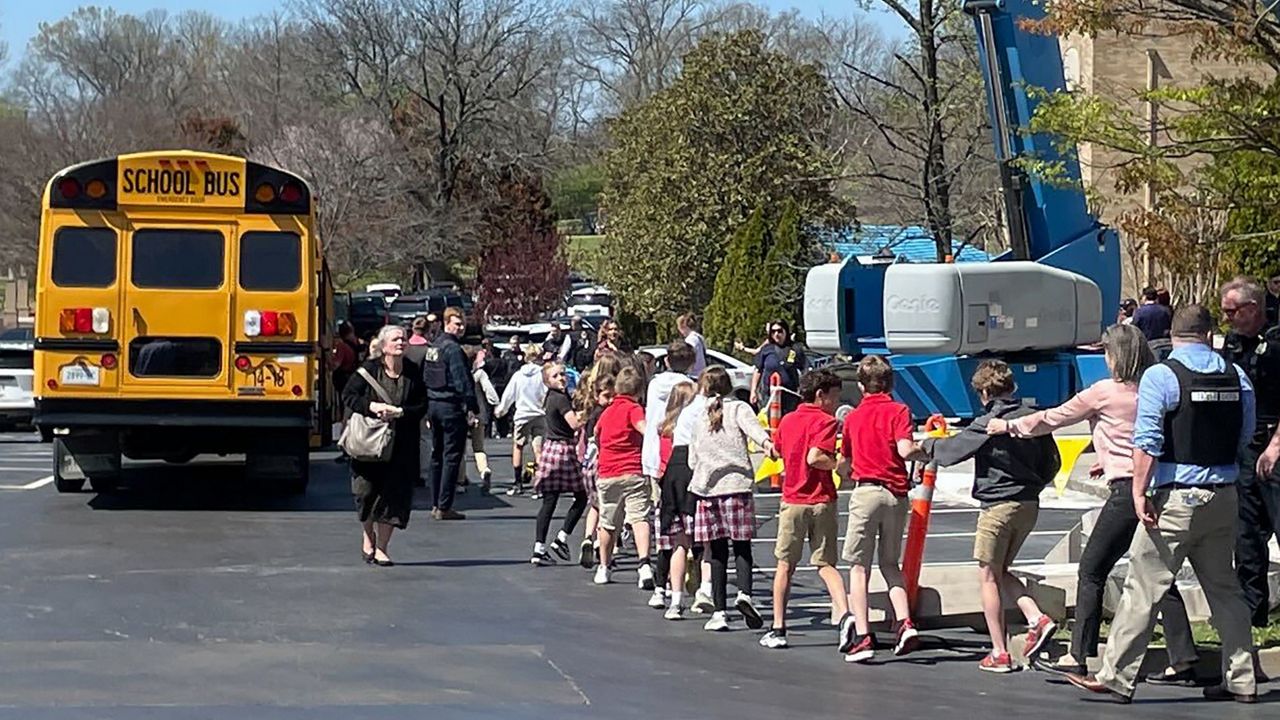  Children from The Covenant School, a private Christian school in Nashville, Tenn., hold hands as they are taken to a reunification site at the Woodmont Baptist Church after a deadly shooting at their school on March 27, 2023. (AP Photo/Jonathan Mattise, File)