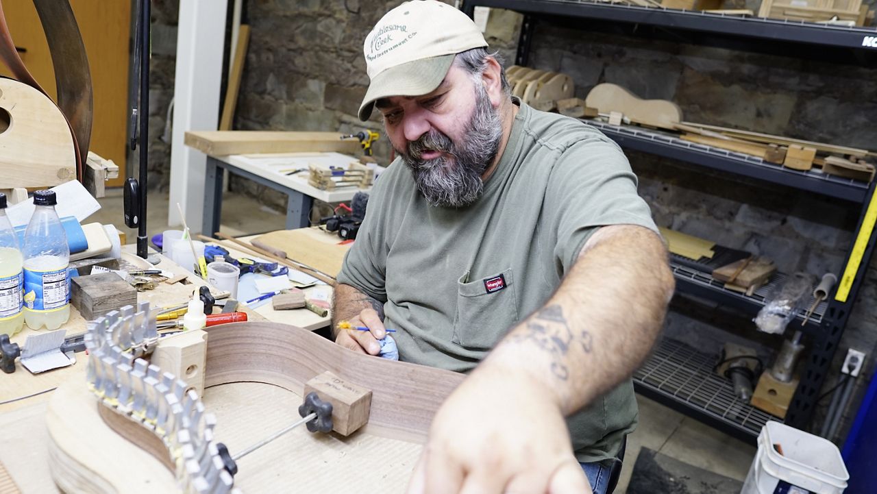 Nathan Smith works as a luthier. A former coal miner, Smith discovered the company though a drug court program (Spectrum News 1/Mason Brighton)