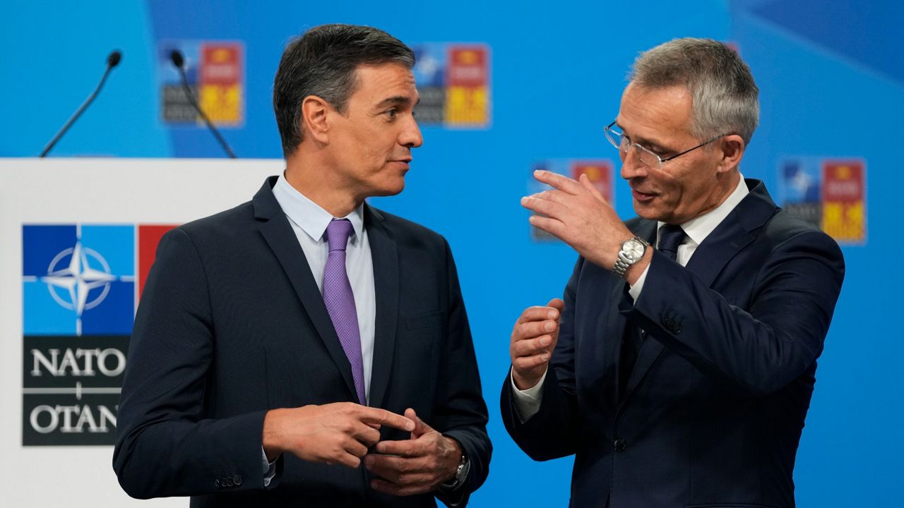 NATO Secretary General Jens Stoltenberg, right, talks Tuesday with Spanish Prime Minister Pedro Sanchez at the NATO summit venue in Madrid, Spain. (AP Photo/Manu Fernandez)