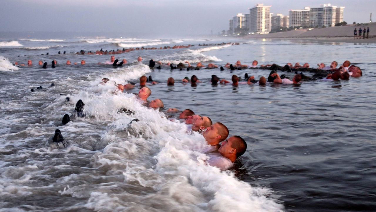 U.S. Navy SEAL candidates participate in "surf immersion" during Basic Underwater Demolition/SEAL training at the Naval Special Warfare Center in Coronado, Calif., on May 4, 2020. (MC1 Anthony Walker/U.S. Navy via AP, File) 