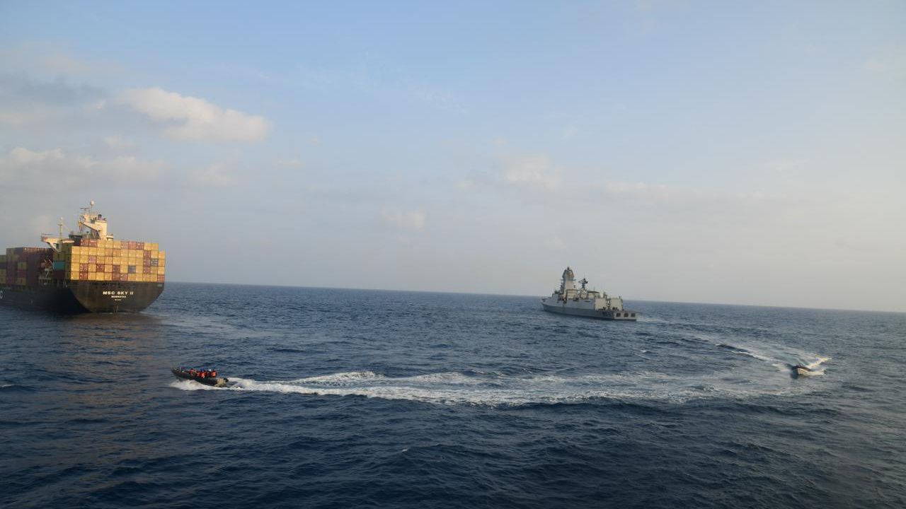 This photograph shared by Indian navy on the X platform shows a firefighting team from Indian Navy vessel INS Kolkata responding to a fire on Liberian-flagged Merchant ship MSC Sky II caused due to a suspected drone/missile attack in the Gulf of Aden, Tuesday, March 5, 2024. (Indian Navy on X via AP)