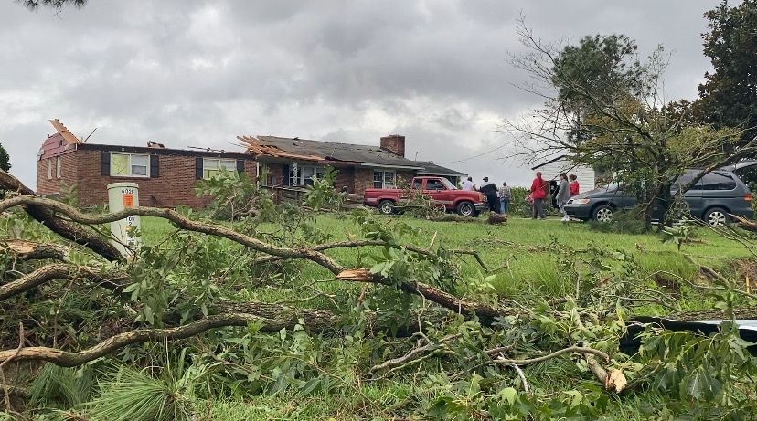 A tornado snapped trees and tore the roof from a home in Sampson County, North Carolina, Wednesday afternoon. (Spectrum News 1/Natalie Mooney)