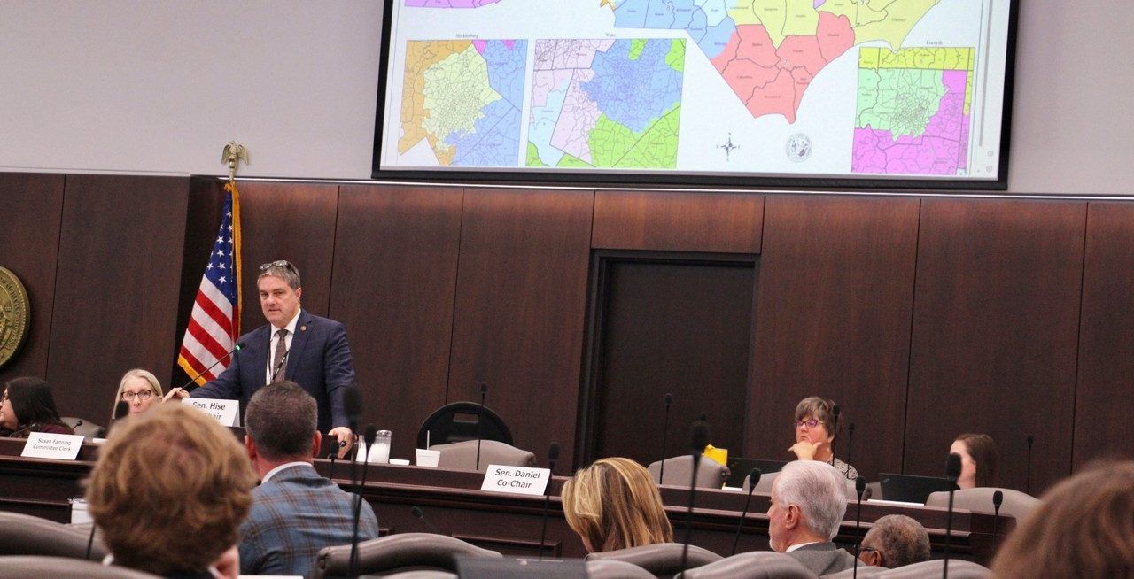 The North Carolina Senate reviews copies of a map proposal for the state's congressional districts starting in 2024 during a committee hearing at the Legislative Office Building, Oct. 19, 2023, in Raleigh, N.C. North Carolina Black and Latino voters sued in federal court on Monday, Dec. 4, seeking to strike down congressional districts drawn this fall by Republican state legislators that they argue weaken minority voting power in violation of the U.S. Constitution. (AP Photo/Hannah Schoenbaum)