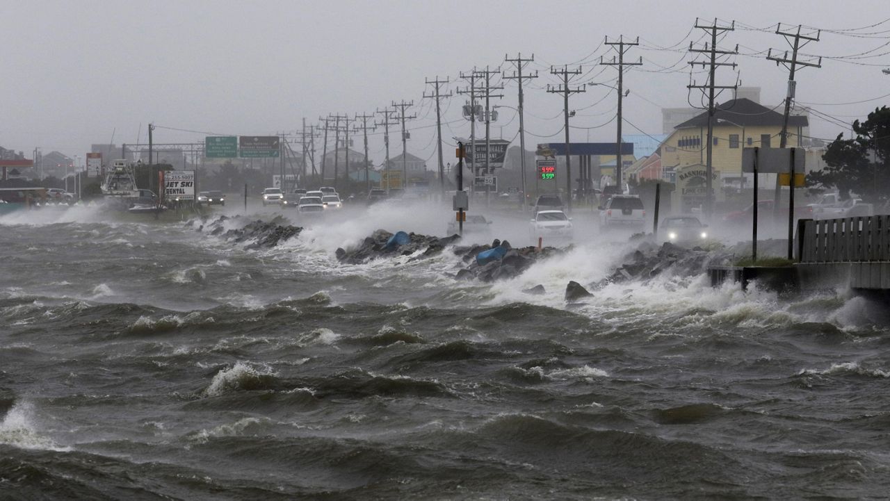 High waves crashing into the street