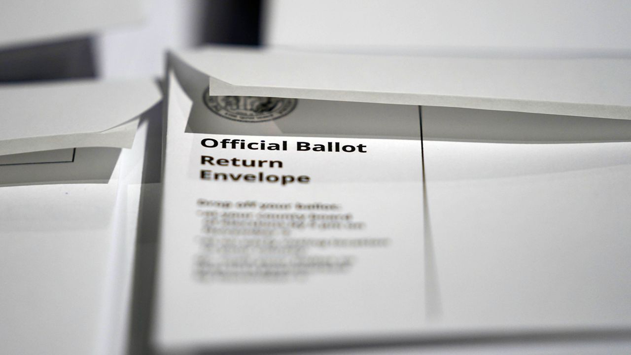 Stacks of ballot envelopes waiting to be mailed are seen at the Wake County Board of Elections on Sept. 3, 2020, in Raleigh, N.C. The North Carolina State Board of Elections denied Thursday, July 14, 2022, a Republican Party request that the board authorize county elections officials to scrutinize signatures on absentee voting documents, citing concerns that the proposal would create unequal standards across counties. (AP Photo/Gerry Broome, File)