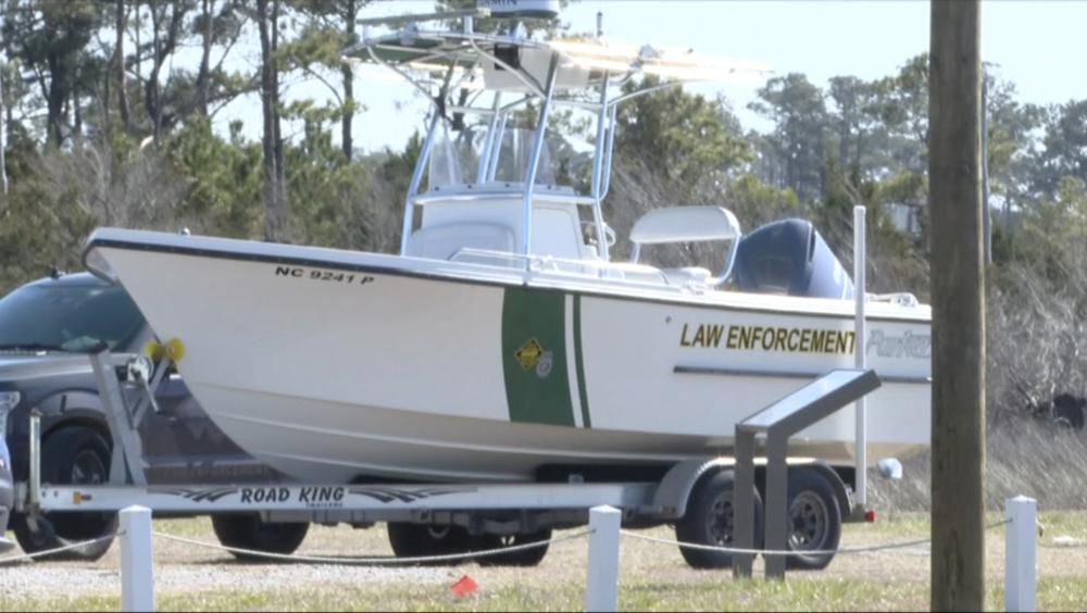 Law enforcement gets ready for a search after a small plane crash in Carteret County, N.C., on Monday, Feb. 14, 2022. 