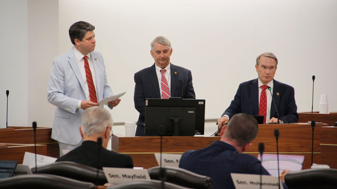 Sen. Brad Overcash, R-Gaston, far left, Sen. Buck Newton, R-Wilson, middle, and Sen. Paul Newton, R-Cabarrus, far right, present three constitutional amendments in a Senate elections committee at the Legislative Building in Raleigh, N.C., on Thursday, June 20, 2024. The three potential referendums center on citizens-only voting, photo identification and income tax caps. (AP Photo/Makiya Seminera)