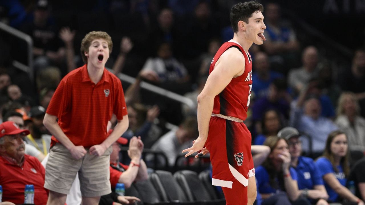 North Carolina State guard Michael O'Connell (12) reacts after hitting a three-pointer against Duke during the second half of an NCAA college basketball game in the quarterfinal round of the Atlantic Coast Conference tournament Thursday, March 14, 2024, in Washington. (AP Photo/Nick Wass)