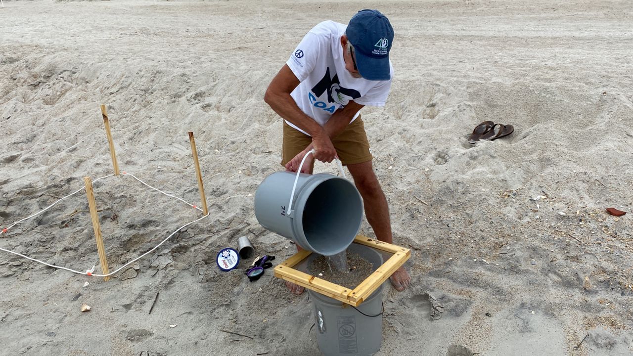 Volunteers with the North Carolina Coastal Federation, including former Wrightsville Beach Mayor David Cignotti, are working to measure microplastics on some of the state's beaches.