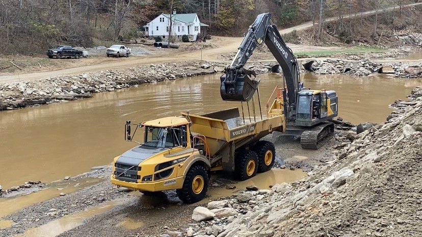 State crews work to repair a road damaged by Hurricane Helene in Yancey County. (Spectrum News 1/Natalie Mooney)