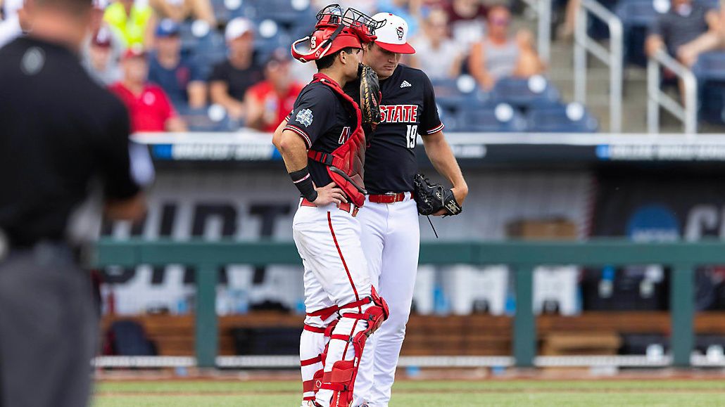 North Carolina State catcher Luca Tresh, left, chats with pitcher Dalton Feeney in the sixth inning against Vanderbilt during a baseball game in the College World Series Friday, June 25, 2021, at TD Ameritrade Park in Omaha, Neb. (AP Photo/Rebecca S. Gratz)
