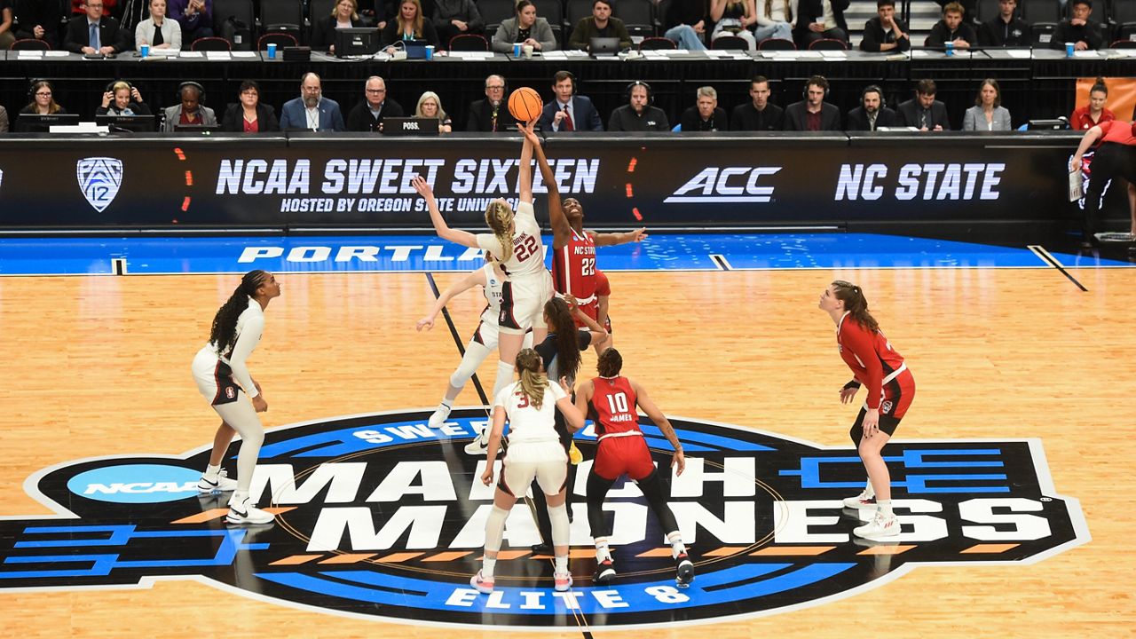Stanford forward Cameron Brink and N.C. State guard Saniya Rivers vie for the ball at tip-off during a Sweet 16 college basketball game in the women's NCAA Tournament against Stanford on Friday, March 29, 2024, in Portland, Ore. (AP Photo/Steve Dykes)