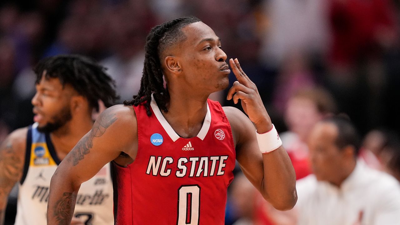 N.C. State's DJ Horne reacts after scoring a basket against Marquette during the second half of a Sweet 16 college basketball game in the NCAA Tournament in Dallas on Friday, March 29, 2024. (AP Photo/Tony Gutierrez)