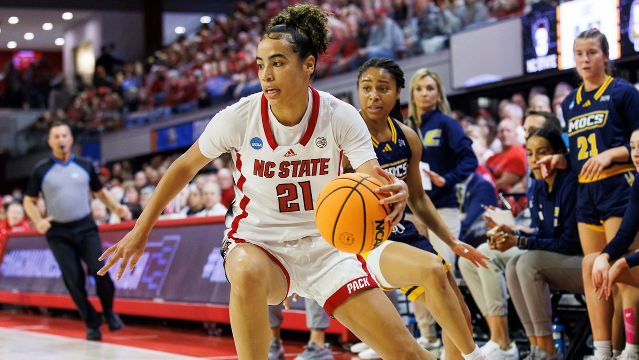 N.C. State's Madison Hayes (21) grabs a loose ball during the first half of a first-round college basketball game against Chattanooga in the NCAA Tournament in Raleigh, N.C., Saturday, March 23, 2024. (AP Photo/Ben McKeown)