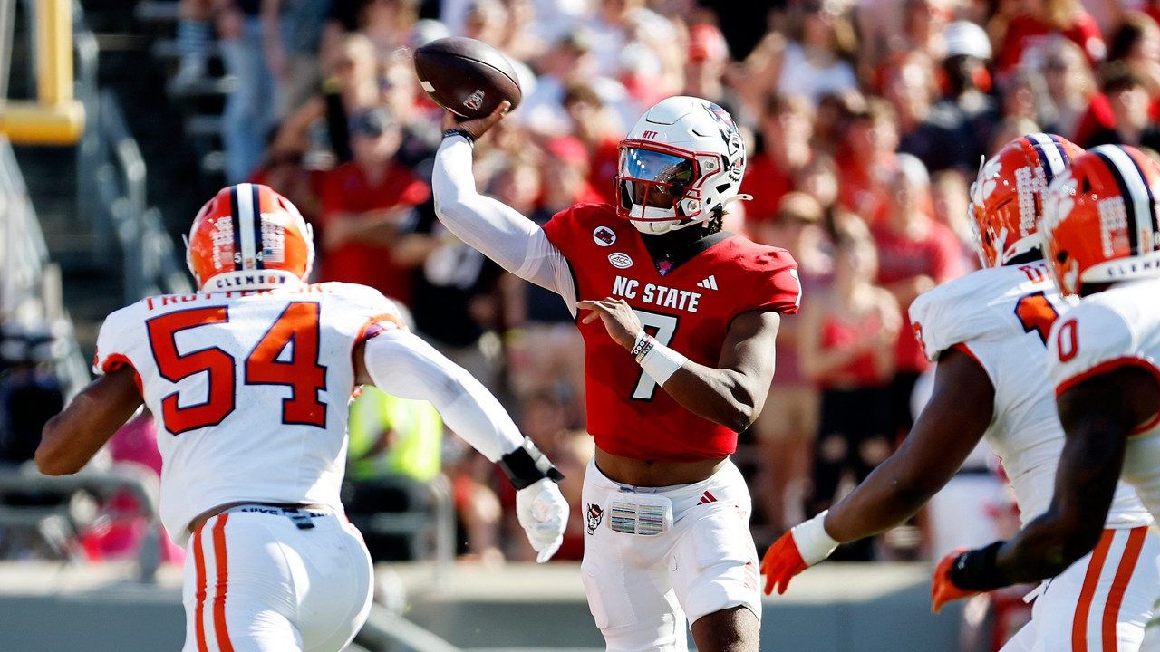 N.C. State quarterback MJ Morris (7) passes the ball as Clemson linebacker Jeremiah Trotter Jr. (54) closes in during an NCAA college football game in Raleigh, N.C., Saturday, Oct. 28, 2023. (AP Photo/Karl B DeBlaker)