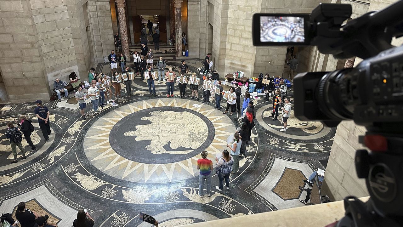 Protesters gather inside the State Capitol building on Friday, May 19, 2023, in Lincoln, Neb., before lawmakers were scheduled to debate a bill to ban abortions at 12 weeks of pregnancy and also ban gender-affirming care for transgender minors. (AP Photo/Nick Ingram, File)