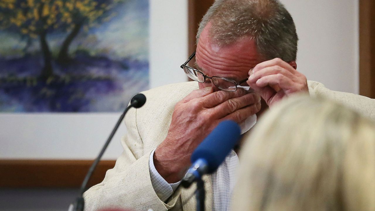 Neil Heslin, father of 6-year-old Sandy Hook shooting victim Jesse Lewis, becomes emotional during his testimony during the trial for Alex Jones, Tuesday Aug. 2, 2022, at the Travis County Courthouse in Austin. Jones has been found to have defamed the parents of a Sandy Hook student for calling the attack a hoax. (Briana Sanchez/Austin American-Statesman via AP, Pool)