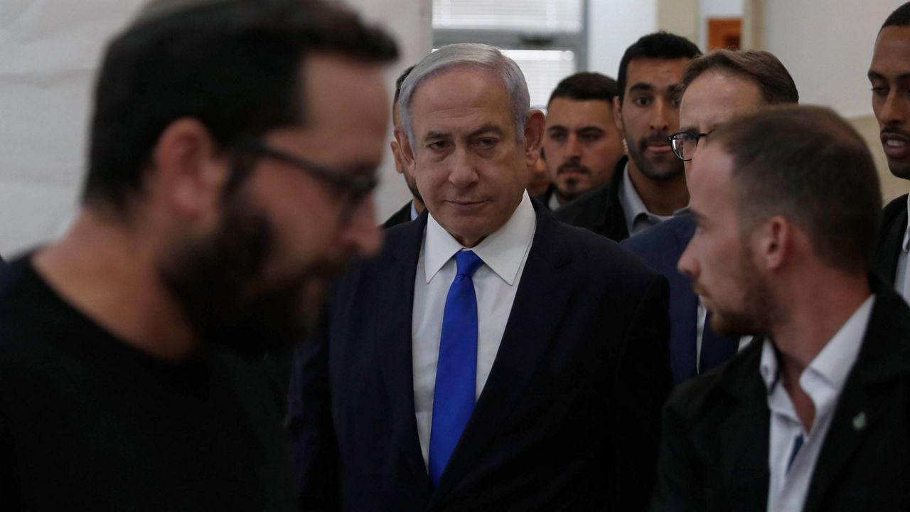 Israeli Prime Minister Benjamin Netanyahu, center, arrives at the District Court in Jerusalem, Israel, June 25, 2023. (Atef Safadi/Pool via AP, File)