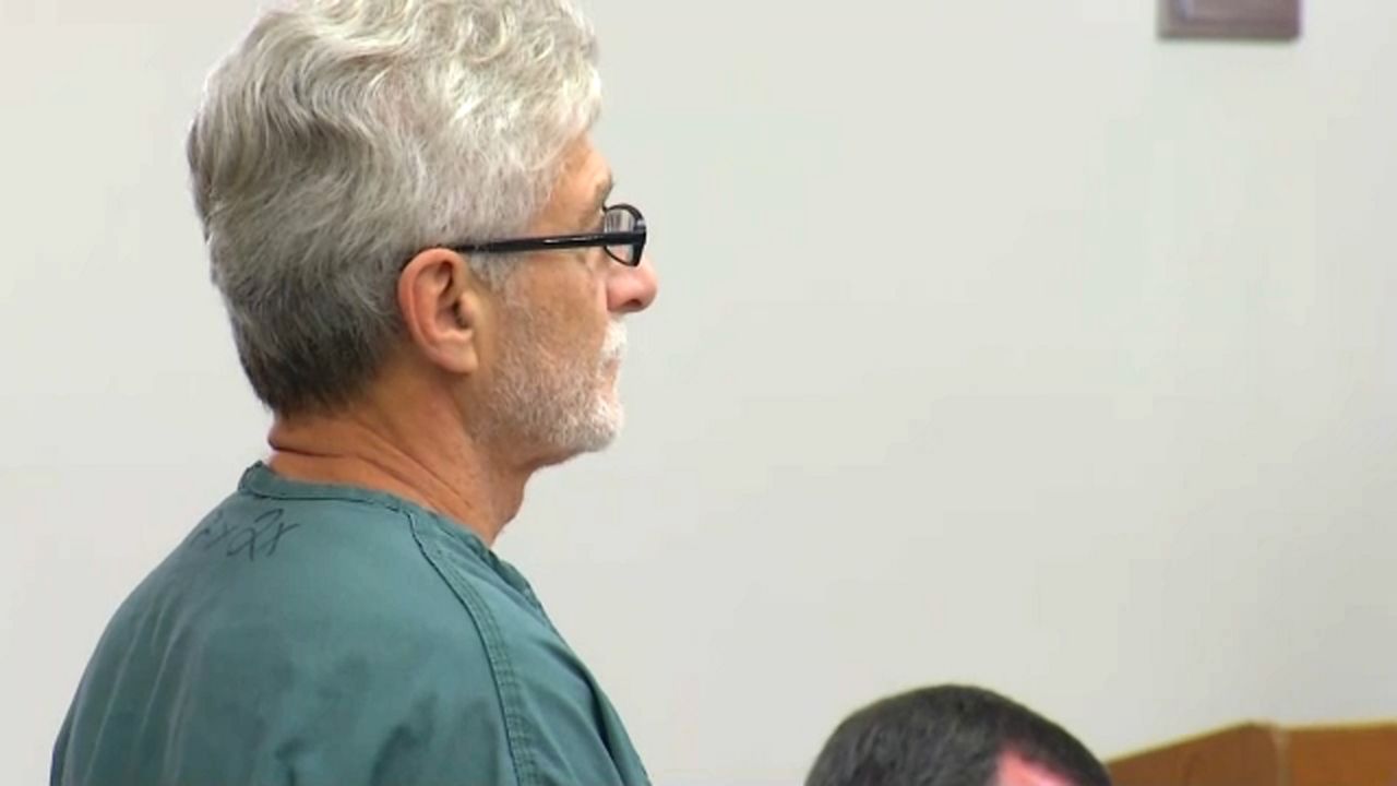 Robert Neulander walking in court