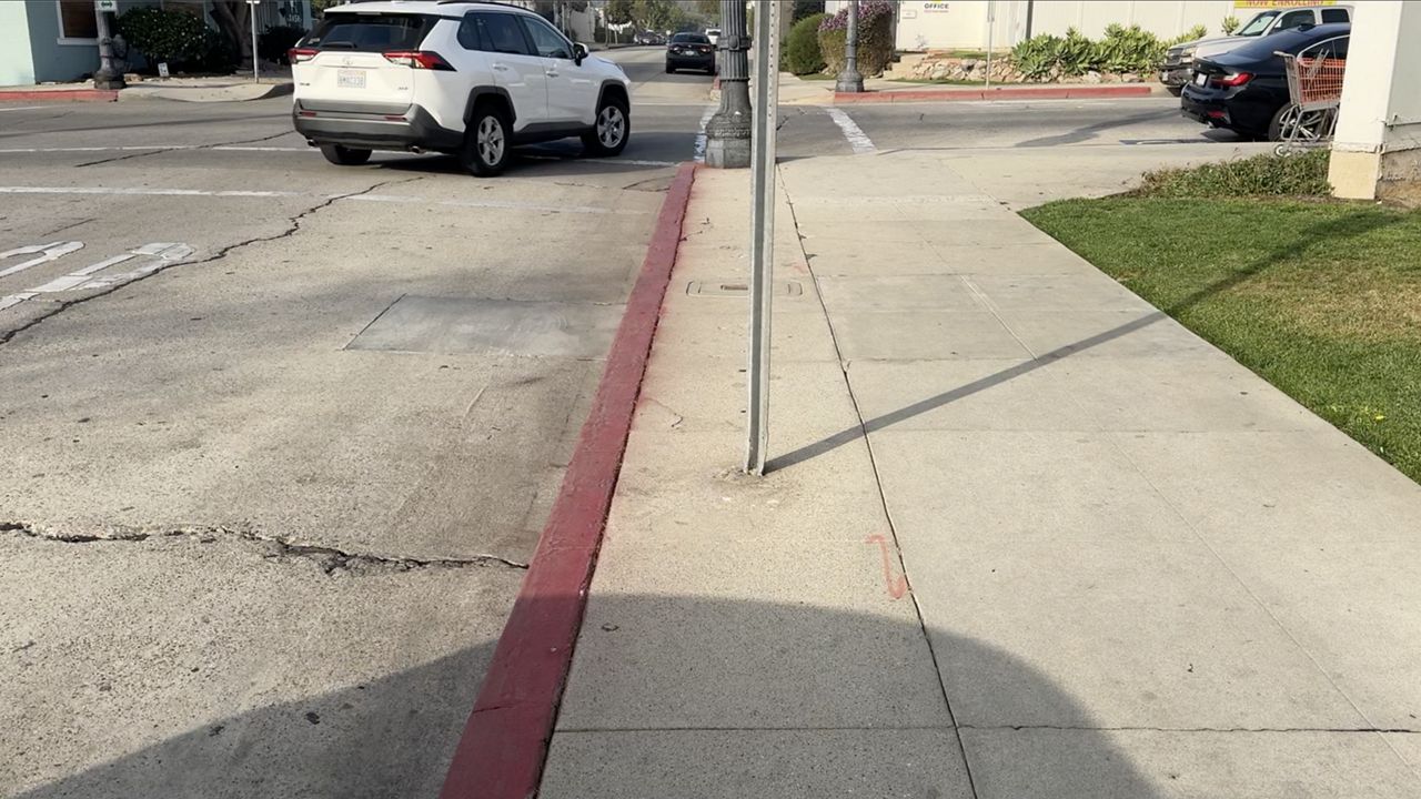 Downtown Whittier has some sidewalks marked with red, to prevent drivers from parking to close to an intersection or crosswalk. (Spectrum News/Shellye Leggett)