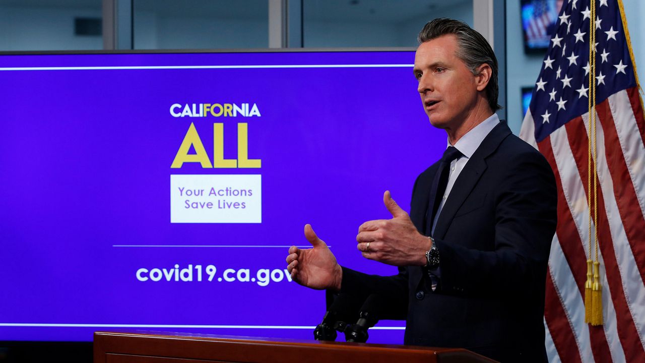 In this photo taken Tuesday April 14, 2020, Gov. Gavin Newsom discusses an outline for what it will take to lift coronavirus restrictions during a news conference at the Governor's Office of Emergency Services in Rancho Cordova, Calif. California lawmakers are launching hearings on Thursday to gather more details on Newsom's spending during the pandemic and the $1 billion contract he entered for protective masks. AP Photo/Rich Pedroncelli)