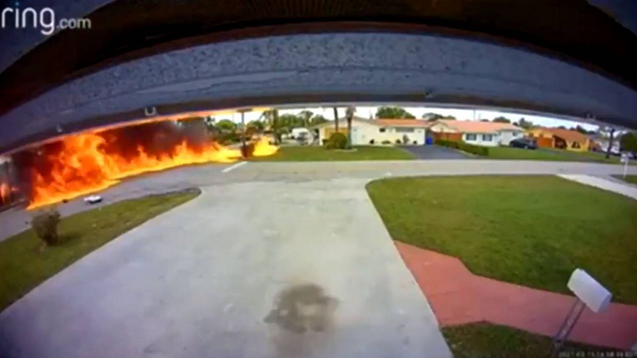 A still image of the fiery plane crash that was captured on Anabel Fernandez's doorbell camera
