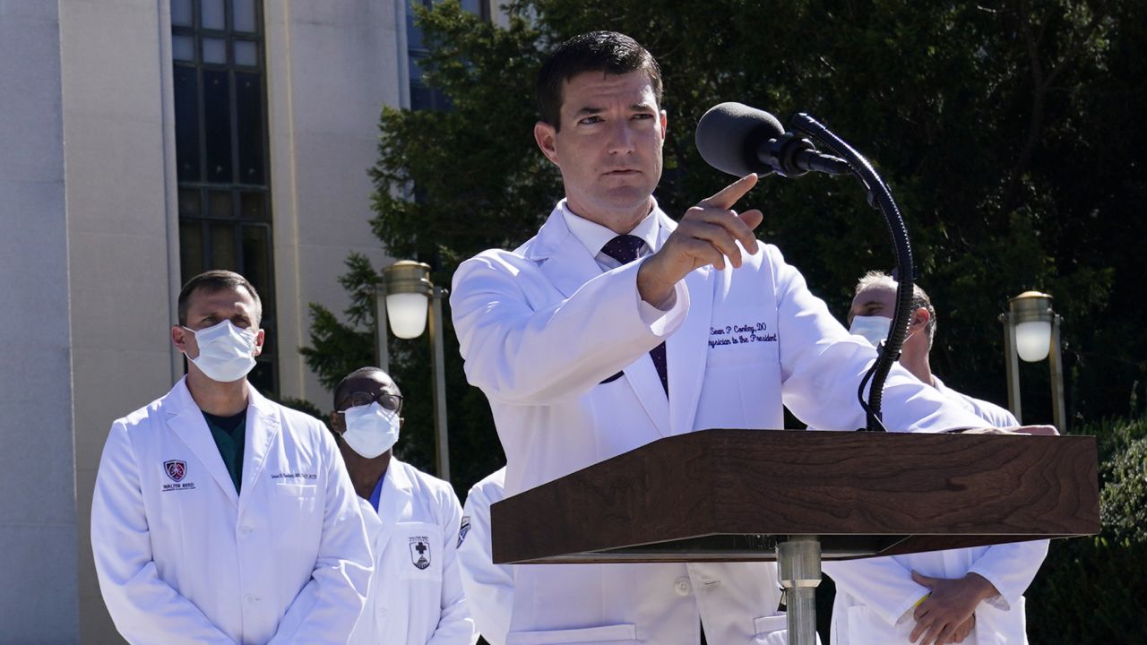 Dr. Sean Conley, physician to President Donald Trump, briefs reporters at Walter Reed National Military Medical Center in Bethesda, Md., Saturday, Oct. 3, 2020. Trump was admitted to the hospital after contracting the coronavirus. (AP Photo/Susan Walsh)