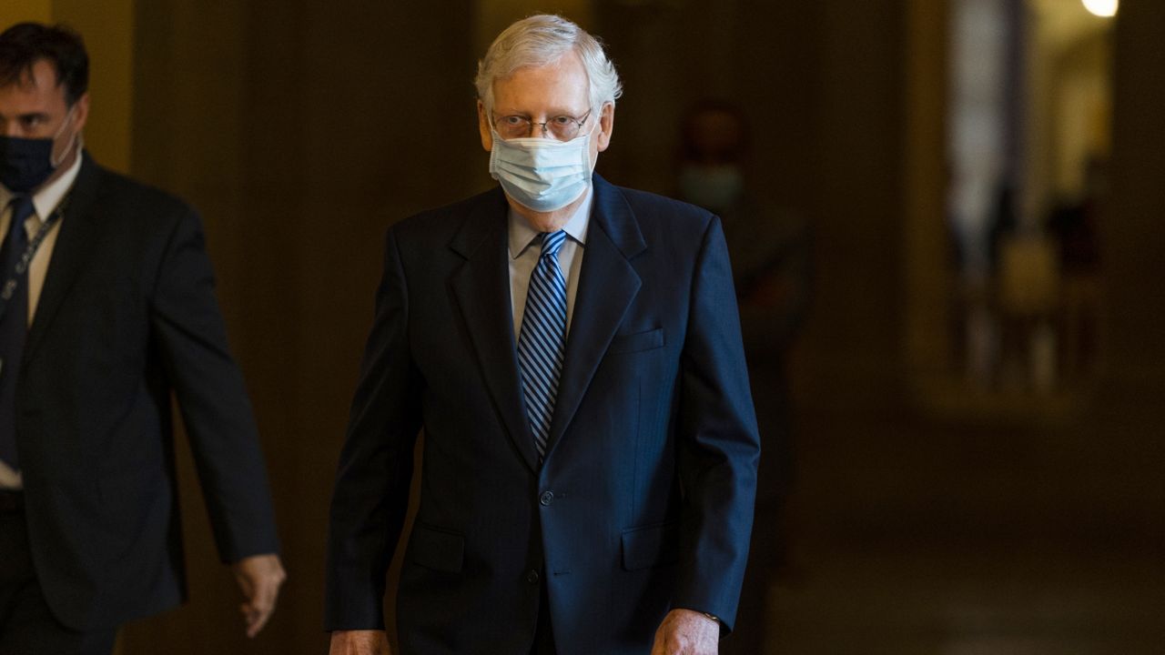 Senate Majority Leader Sen. Mitch McConnell of Ky. walks towards the Senate floor on Capitol Hill, Thursday, Oct. 1, 2020, in Washington. (AP Photo/Manuel Balce Ceneta)