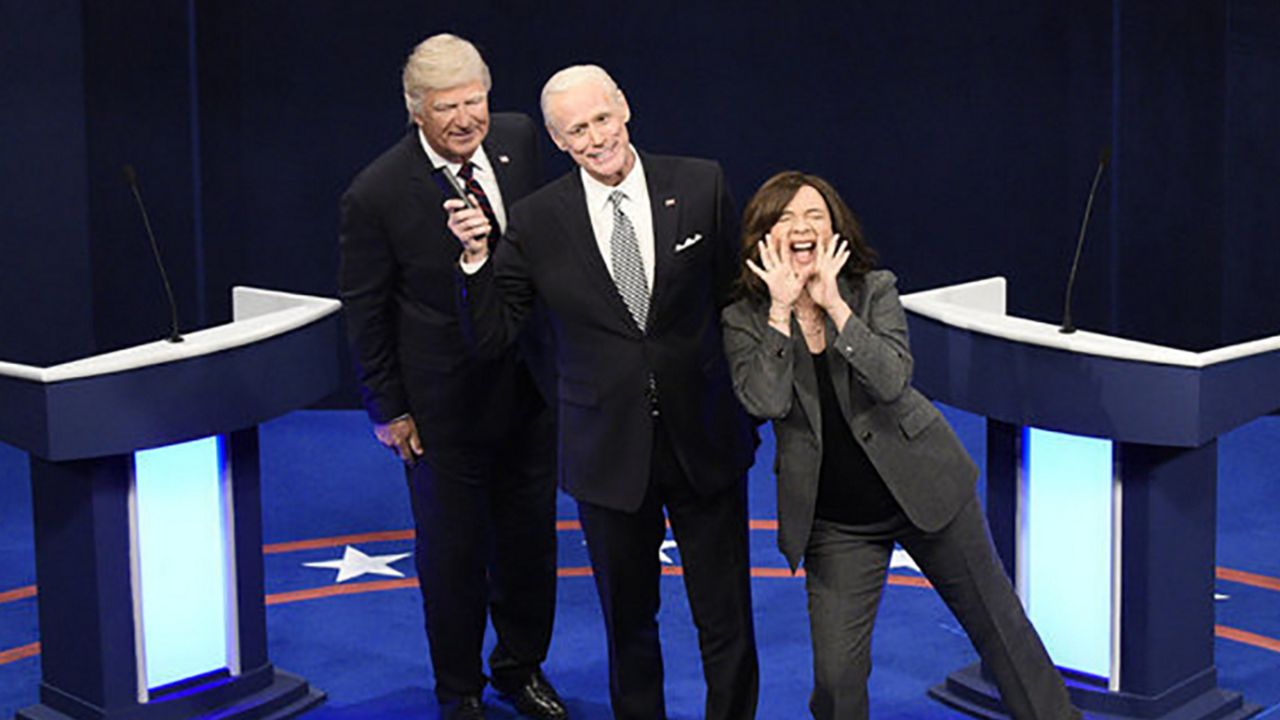 This image released by NBC shows Alec Baldwin as Donald Trump, from left, Jim Carrey as Joe Biden and Maya Rudolph as Kamala Harris during the "First Debate" Cold Open on "Saturday Night Live" in New York on Oct. 3, 2020. (Will Heath/NBC via AP)