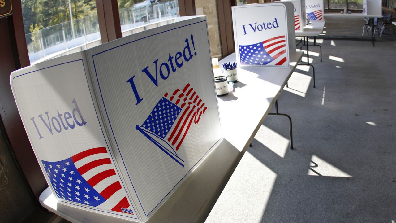 FILE: An early election ballot completion area is being prepared at a collection location at the North Park Ice Skating Rink Lodge area, Friday, Oct. 9, 2020, in McCandless, Pa. (AP Photo/Keith Srakocic)