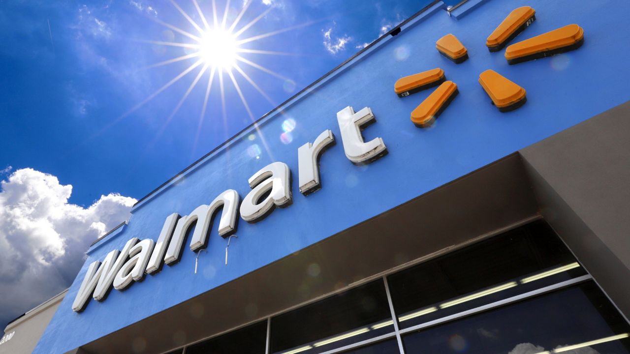 FILE - Entrance to a Walmart in Pittsburgh. Walmart is spreading out its traditional one-day Black Friday deals over three weekends in November 2020 in an effort to reduce crowds in its stores amid the coronavirus pandemic. (AP Photo/Gene J. Puskar, File)