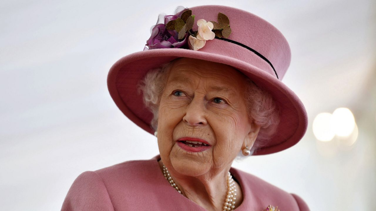 Britain's Queen Elizabeth II visits the Defence Science and Technology Laboratory (DSTL) at Porton Down, England, Thursday Oct. 15, 2020, to view the Energetics Enclosure and display of weaponry and tactics used in counter intelligence. (Ben Stansall/Pool via AP)