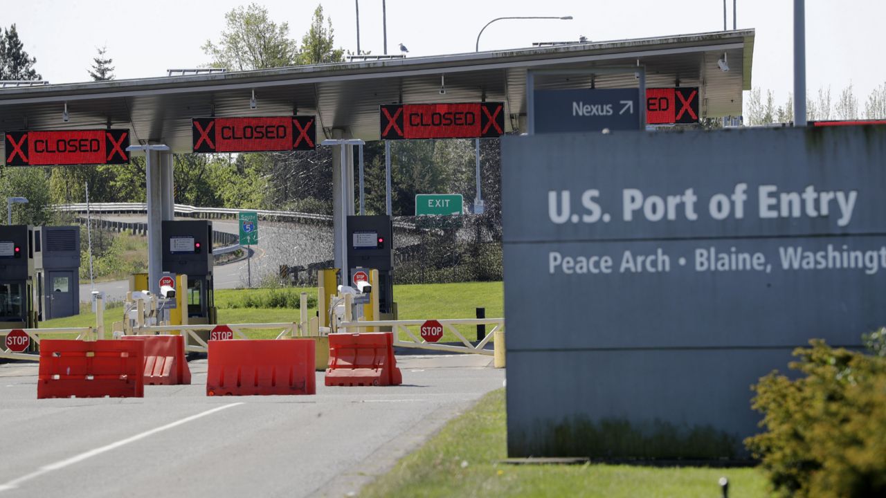 Most lanes remain closed at the Peace Arch border crossing into the U.S. from Canada, where the shared border has been closed for nonessential travel in an effort to prevent the spread of the coronavirus, Thursday, May 7, 2020, in Blaine, Wash. (AP Photo/Elaine Thompson)