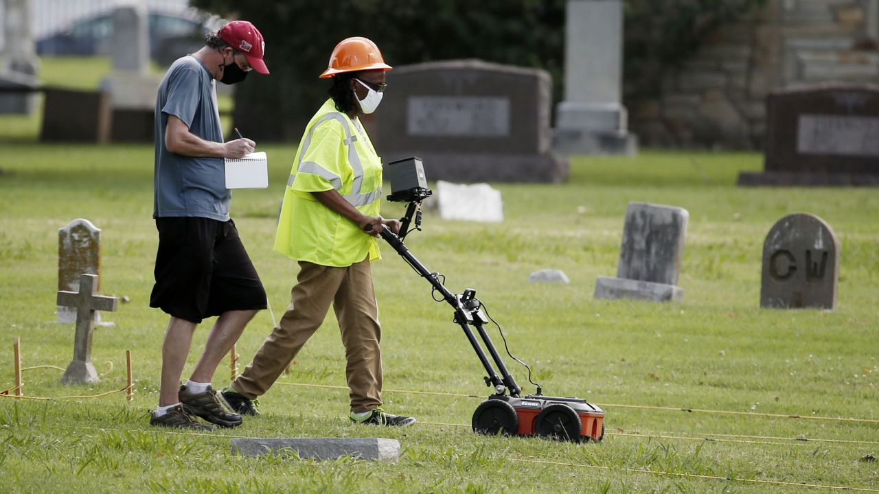 FILE - In this July 17, 2020, file photo, workers use ground penetrating radar as work continues on a search for a potential unmarked mass grave from the 1921 Tulsa Race Massacre, at Oaklawn Cemetery in Tulsa, Okla. (AP Photo/Sue Ogrocki File)