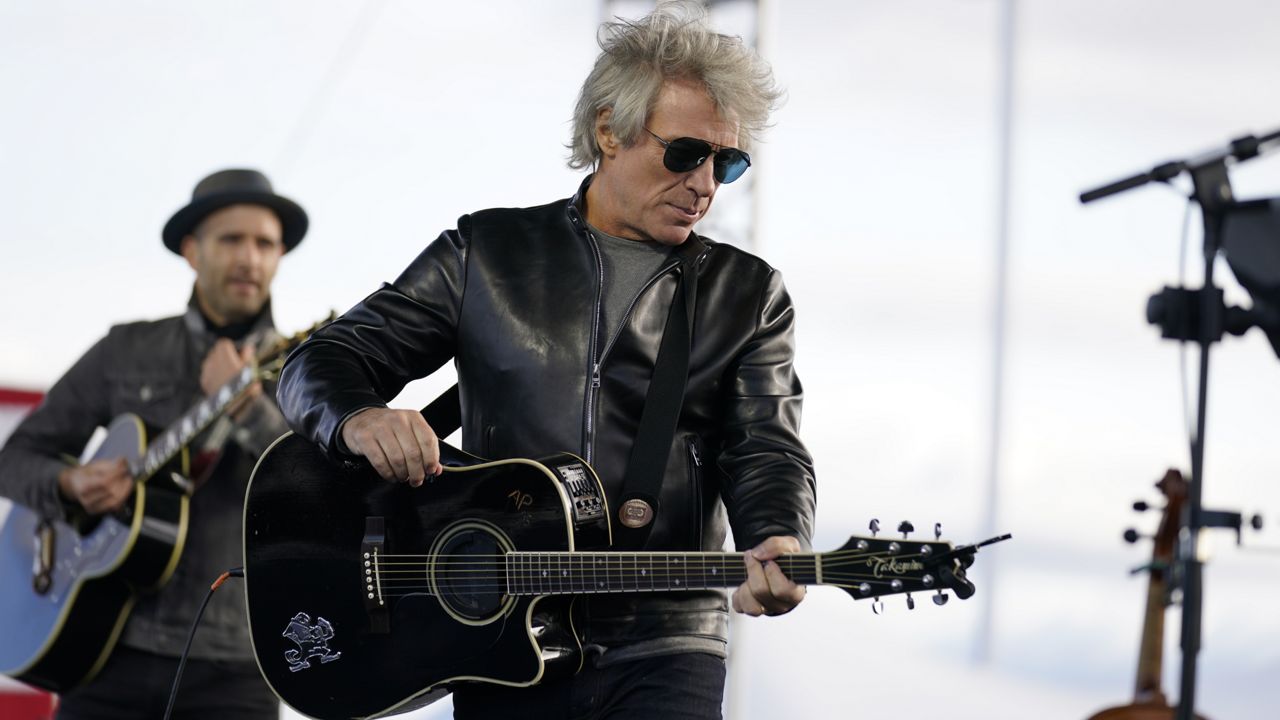 Musician Jon Bon Jovi performs at a campaign event for Democratic presidential candidate former Vice President Joe Biden at Dallas High School in Dallas, Pa., Saturday, Oct. 24, 2020. (AP Photo/Andrew Harnik)