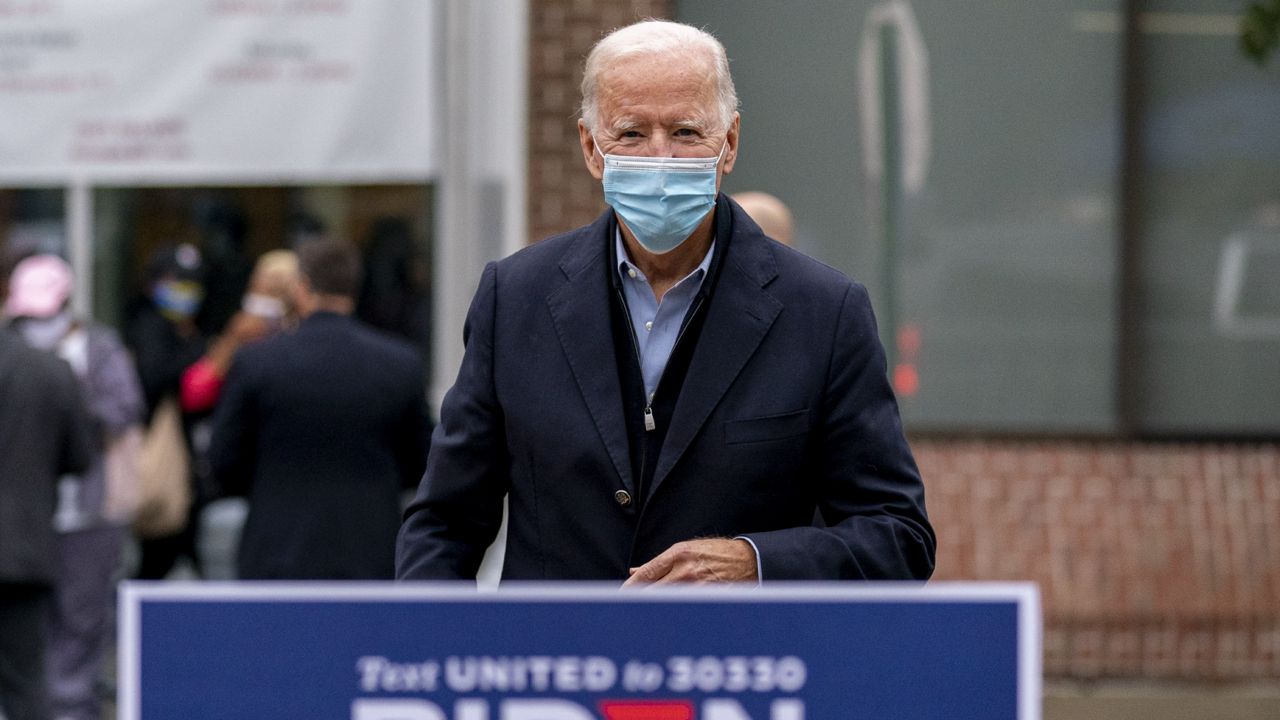 Democratic presidential candidate former Vice President Joe Biden walks to the podium to speak to reporters outside a voter service center, Monday, Oct. 26, 2020, in Chester, Pa. (AP Photo/Andrew Harnik)